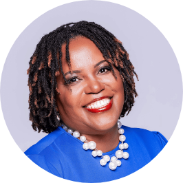 a woman smiling with a necklace