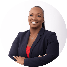 a woman in a suit with her arms crossed