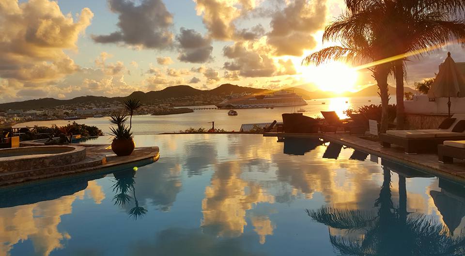 a pool with a sunset