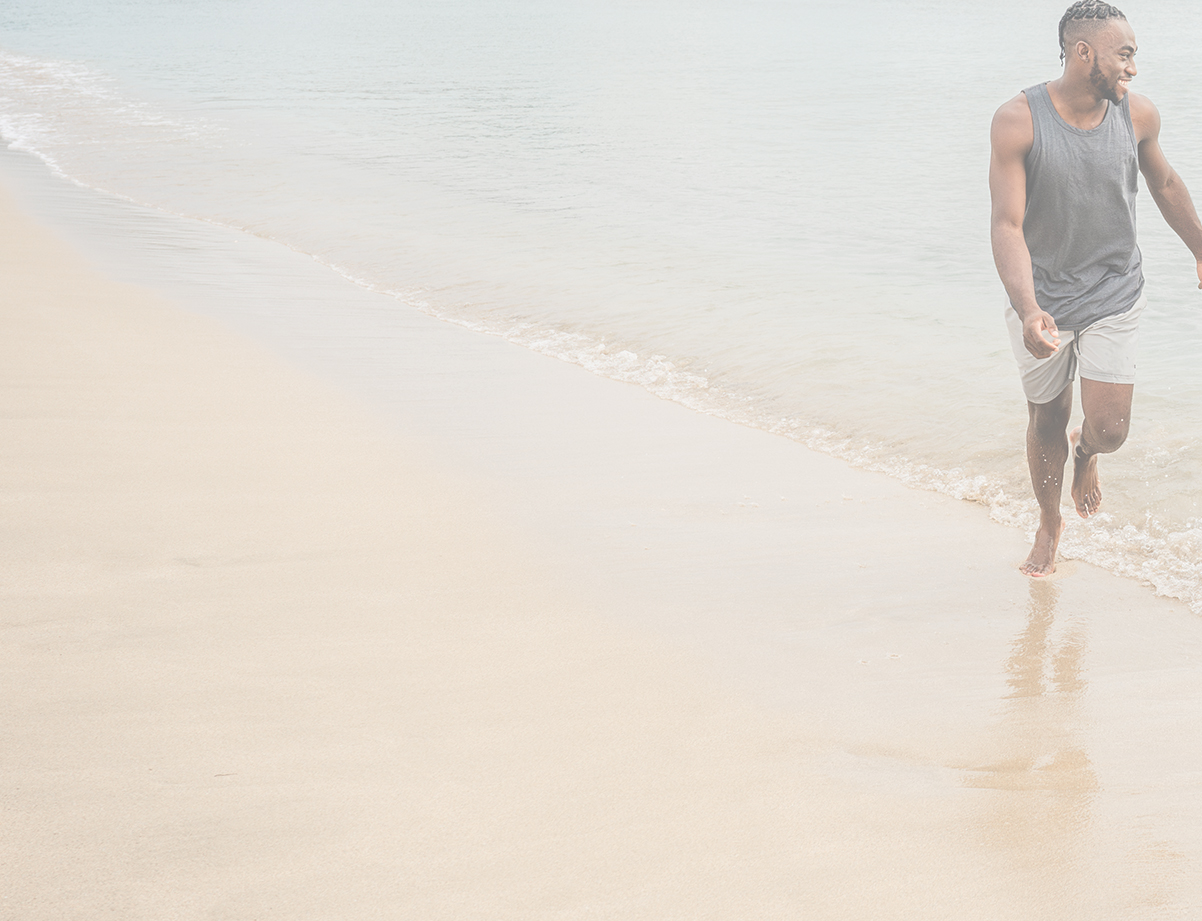 a man walking on a beach