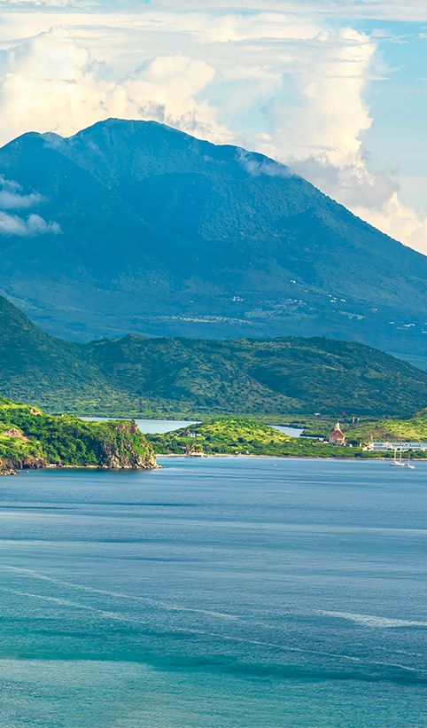 a body of water with a body of water and a mountain in the background