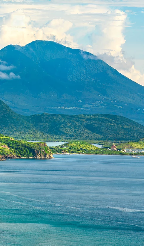 a body of water with a body of water and a mountain in the background