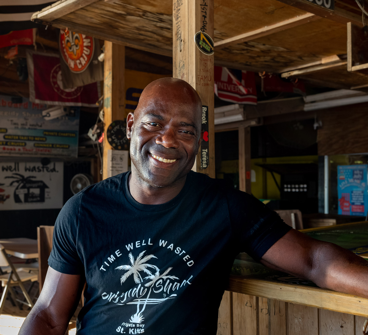 a kittitian man smiling for the camera