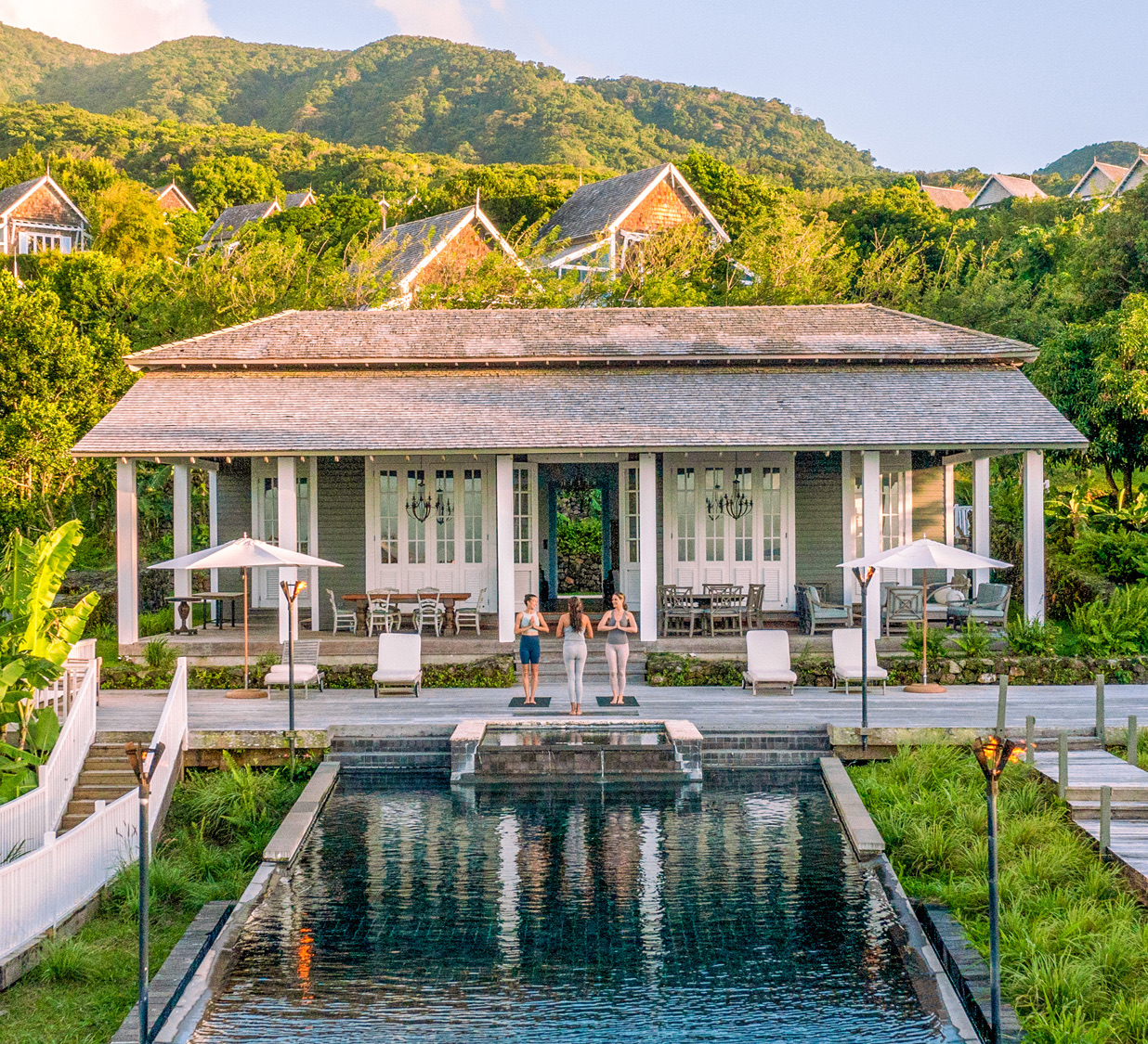 a house with a pool in front