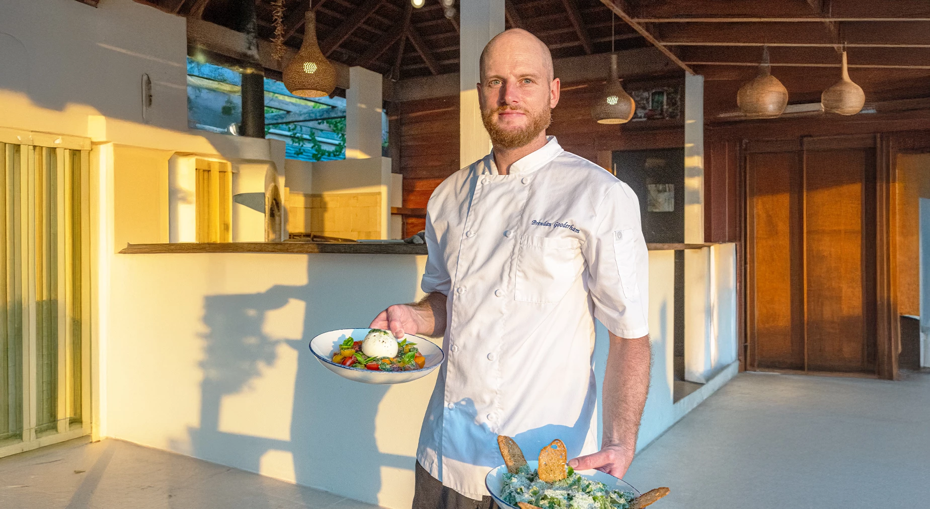 a man holding a bowl of food