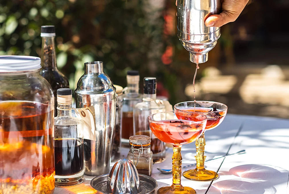 a table with bottles and glasses of rum