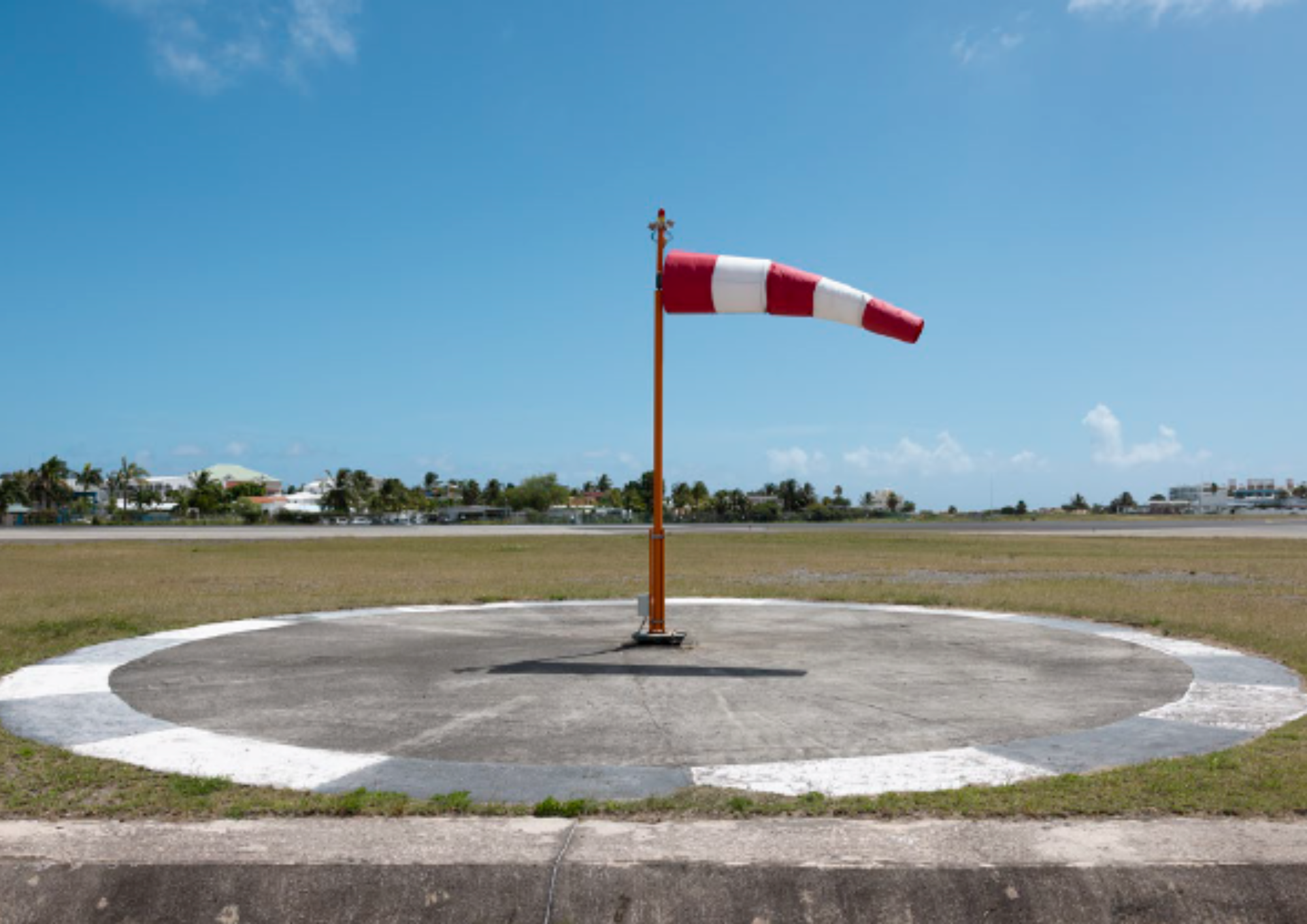 a windsock on a round concrete circle