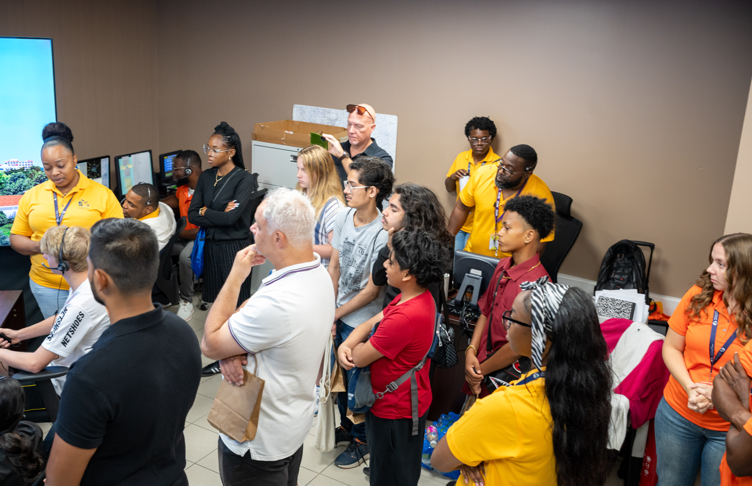 a group of people standing in a room