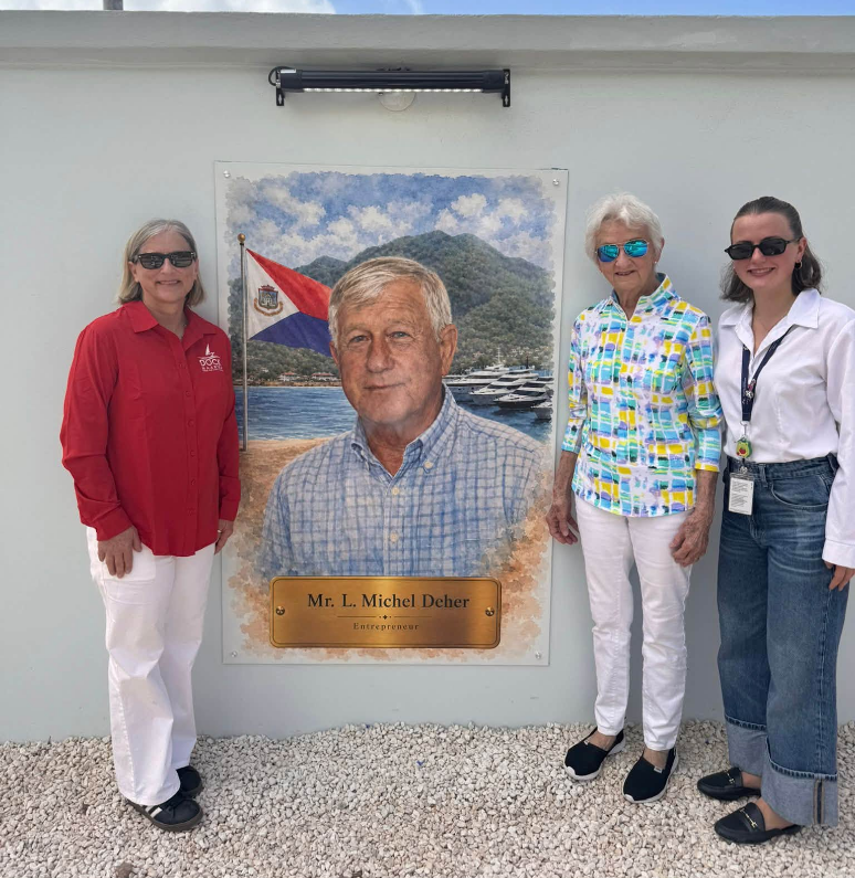 a group of women standing in front of a painting of a man