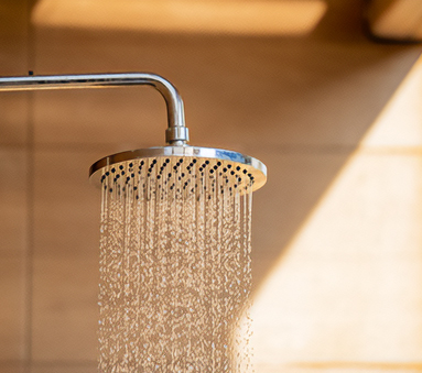 a shower head with water running down