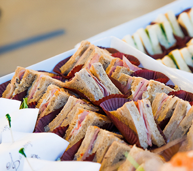 a tray of sandwiches on a table