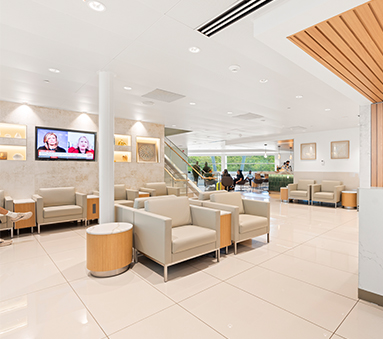 a room with white chairs and a white wall