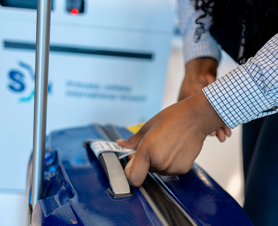 a person holding a piece of luggage