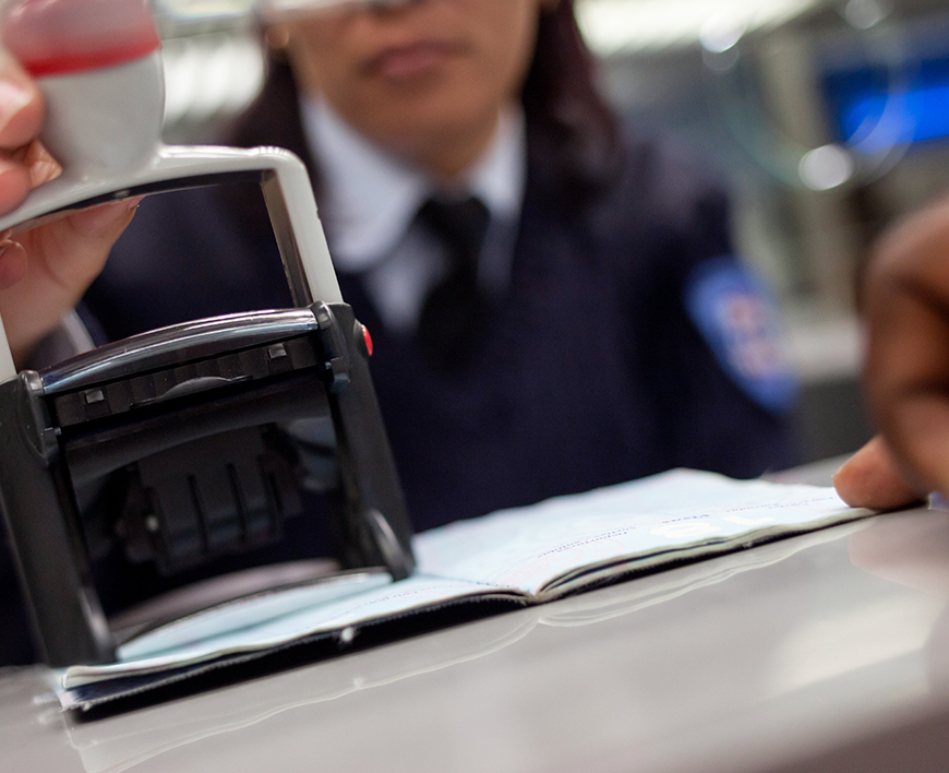 a person in a uniform and a stamp