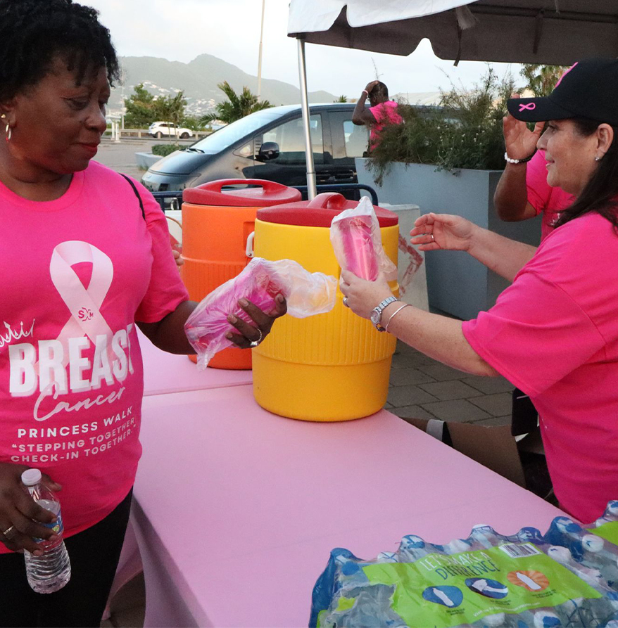 a group of women in pink shirts