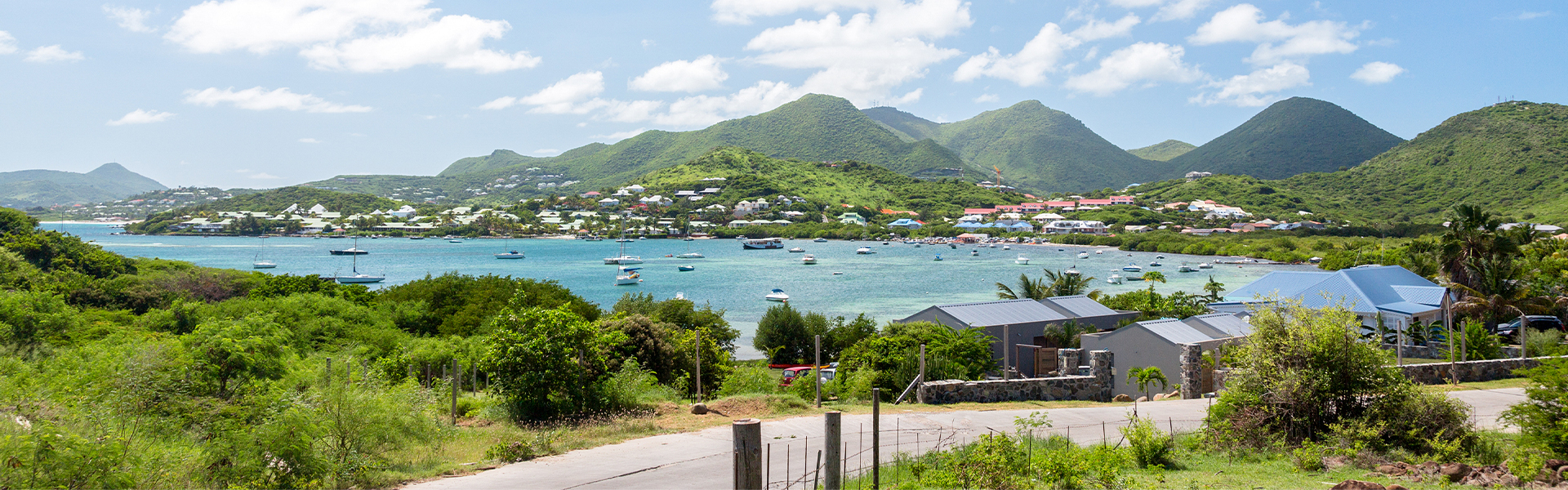 a body of water with boats and buildings in the background