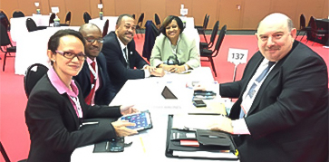 a group of people sitting around a table