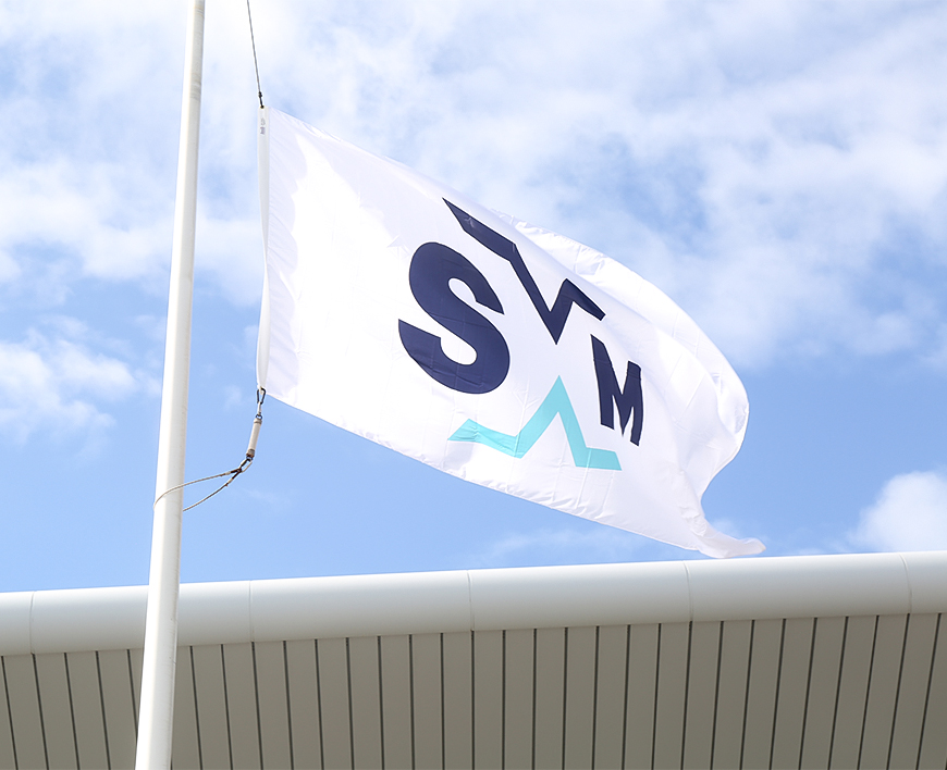 a white flag with blue text on it