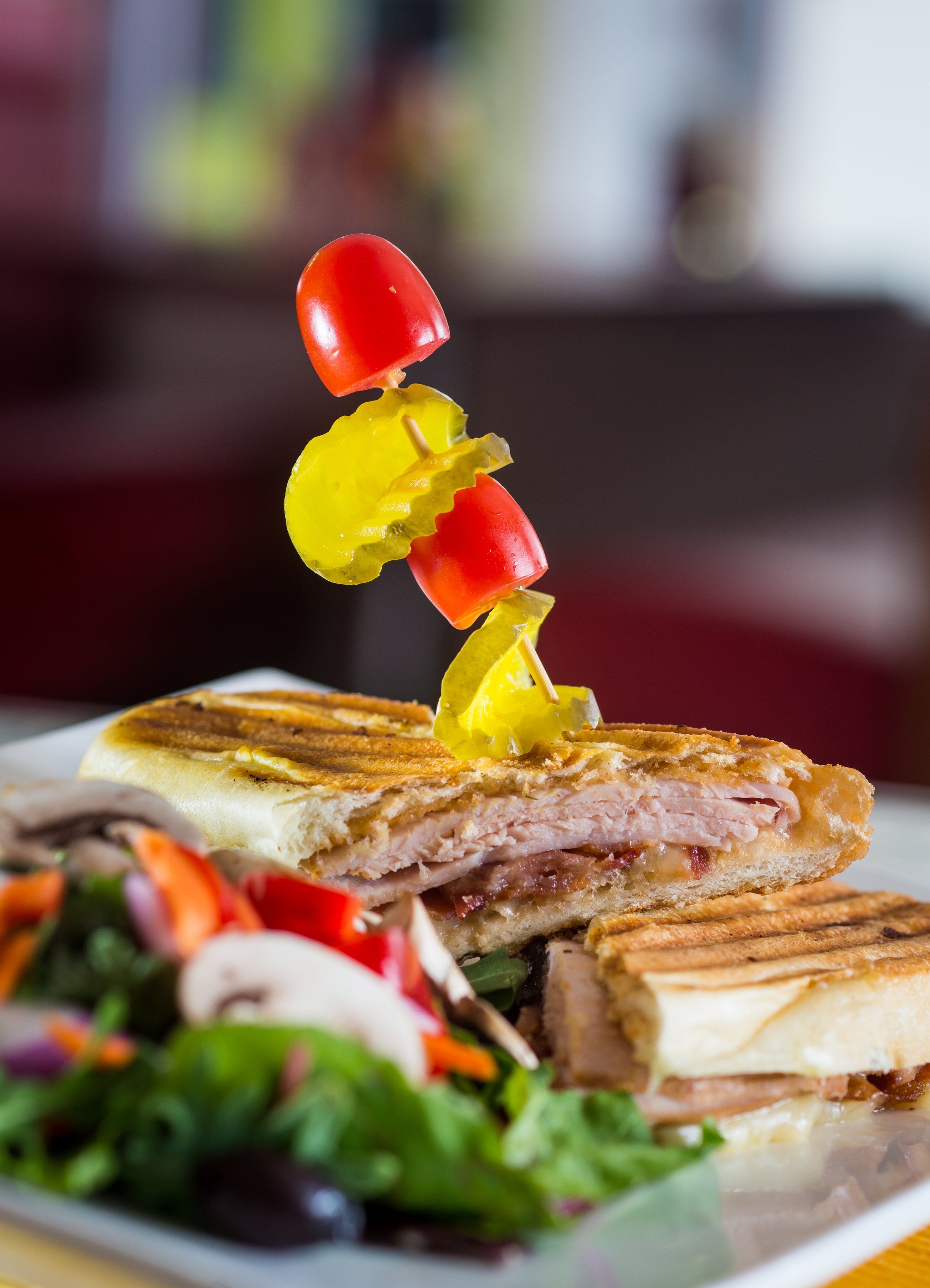 a sandwich with vegetables on top