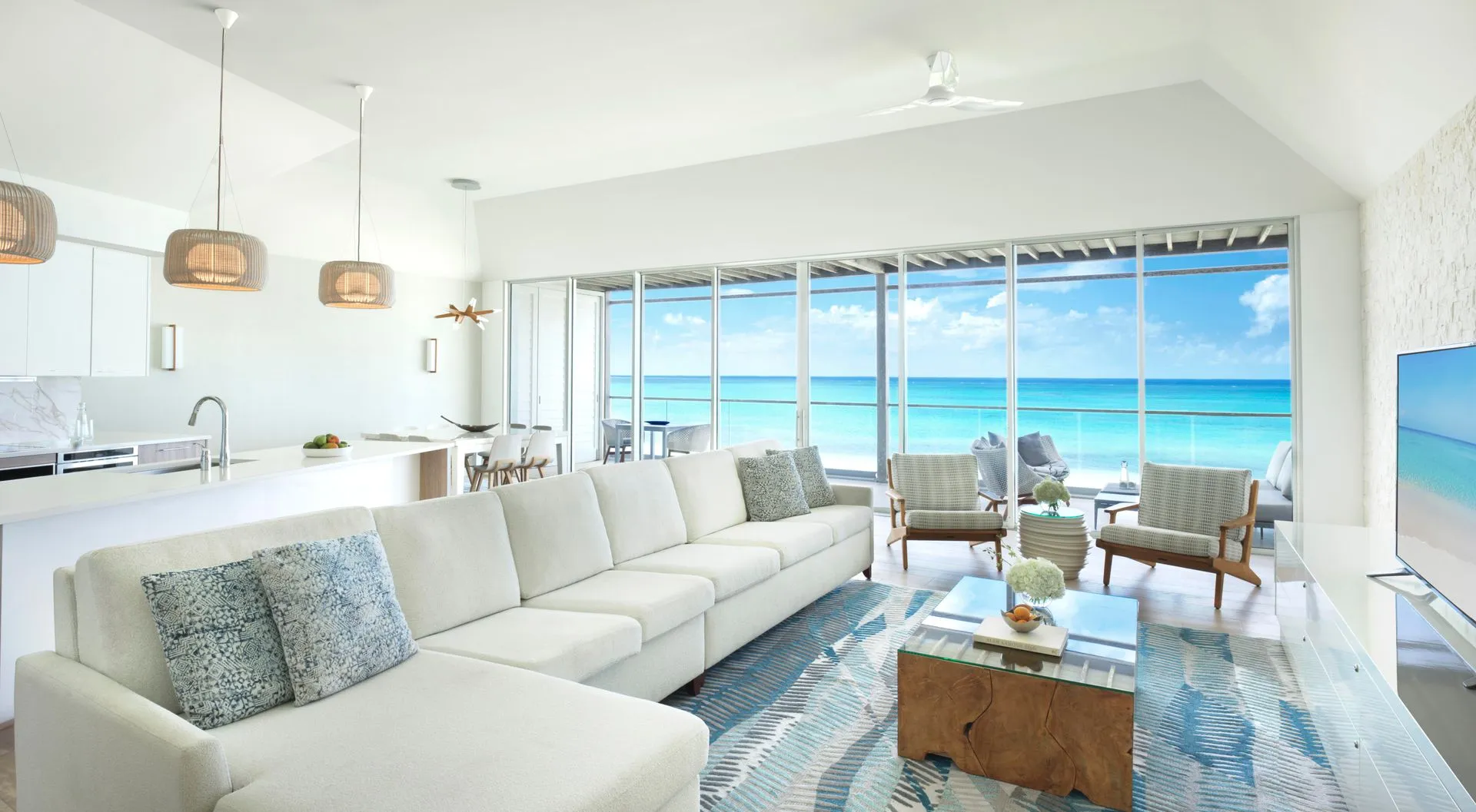 a living room with a large couch and a table