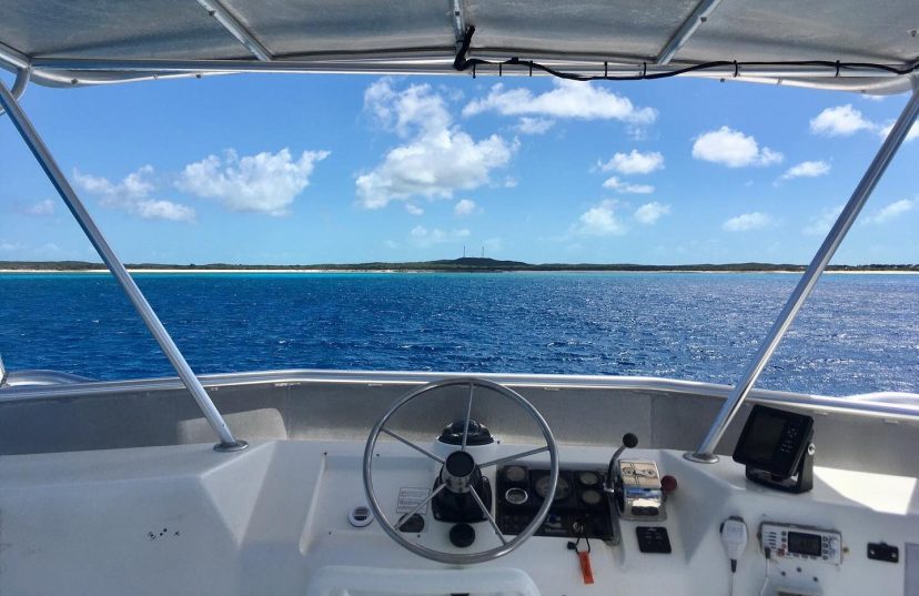 a steering wheel on a boat