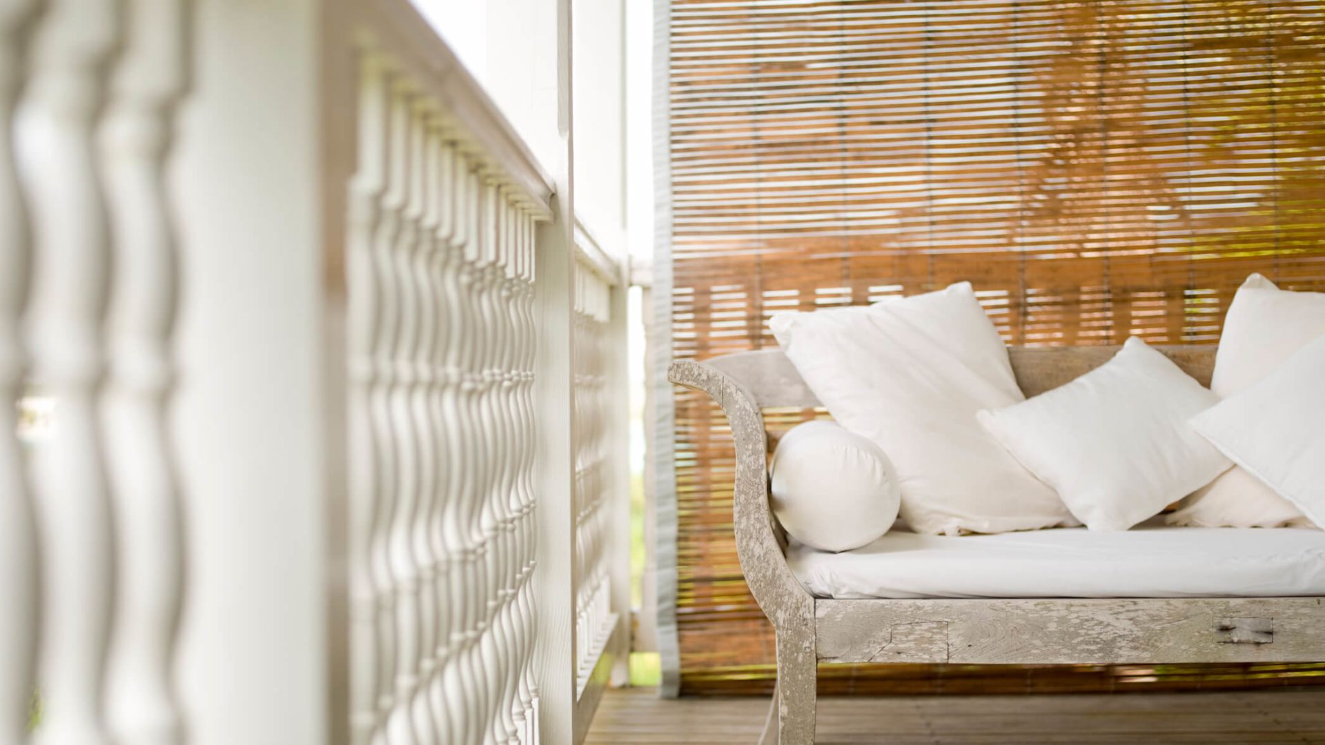 a white couch on a porch