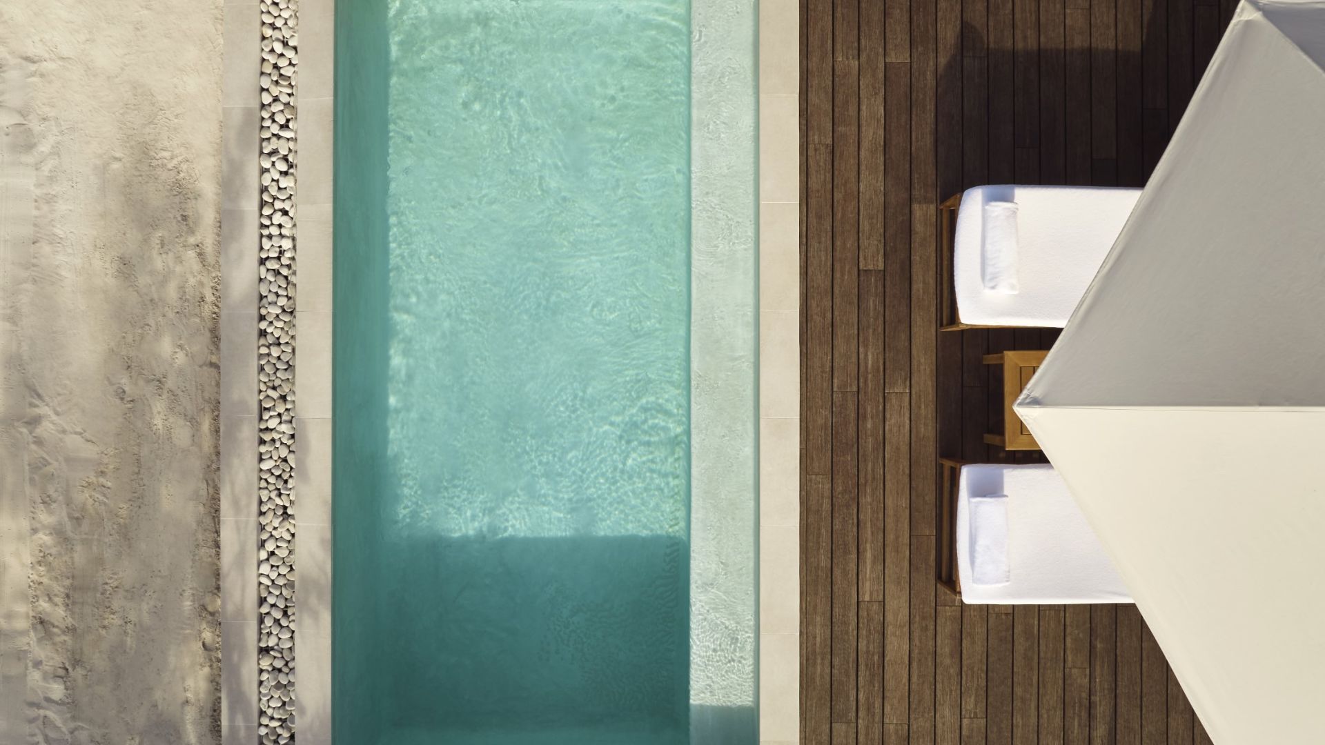 a pool with chairs and a deck
