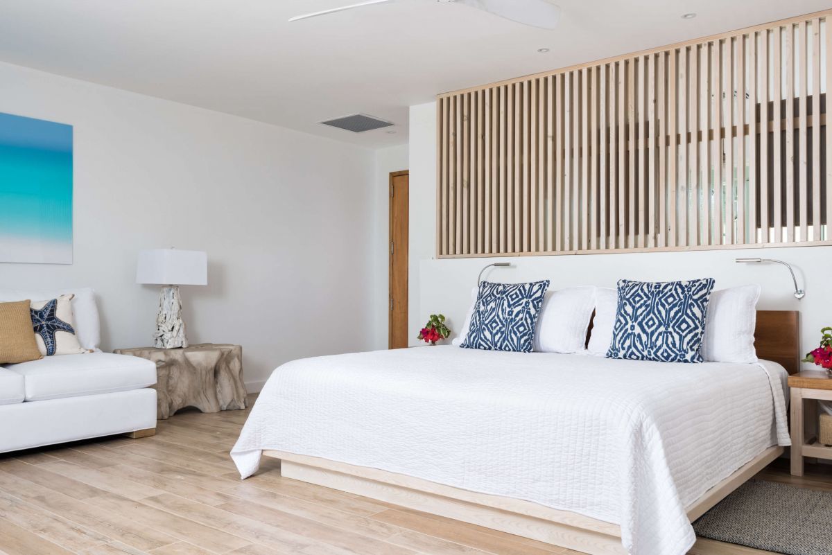 a bedroom with a bed and a lamp