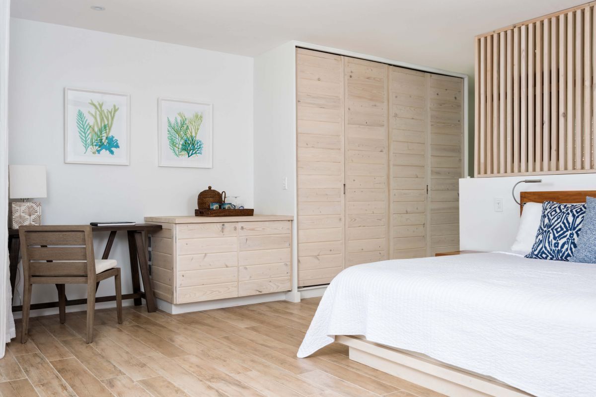 a bedroom with a bed and a desk