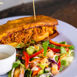 a plate of food with a side of salad