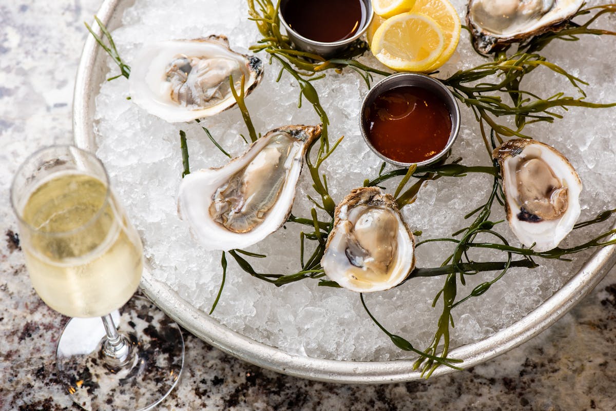 a plate of oysters and sauces