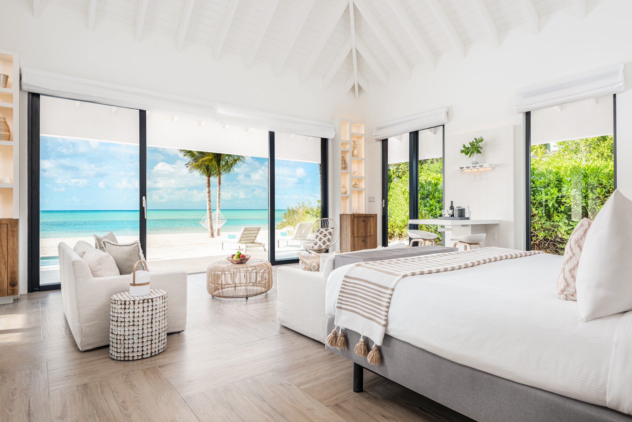 a bedroom with a view of the ocean