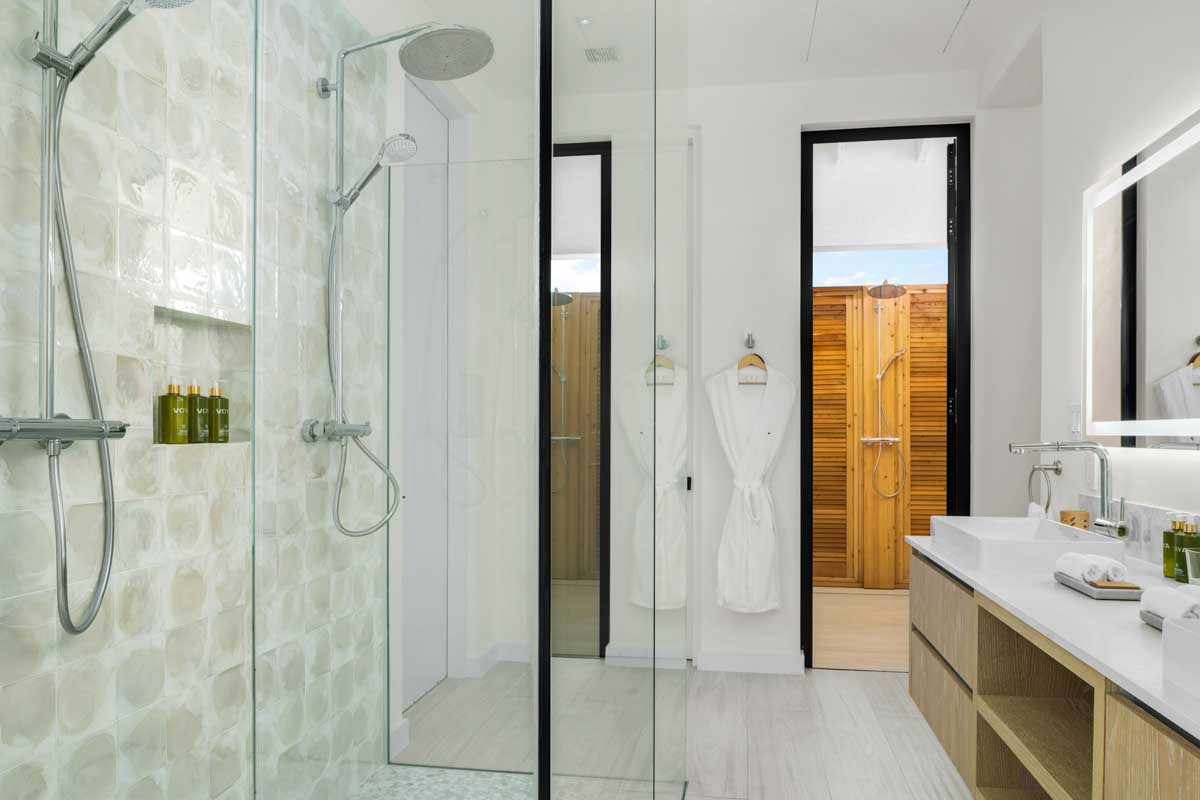 a bathroom with a shower and a sink