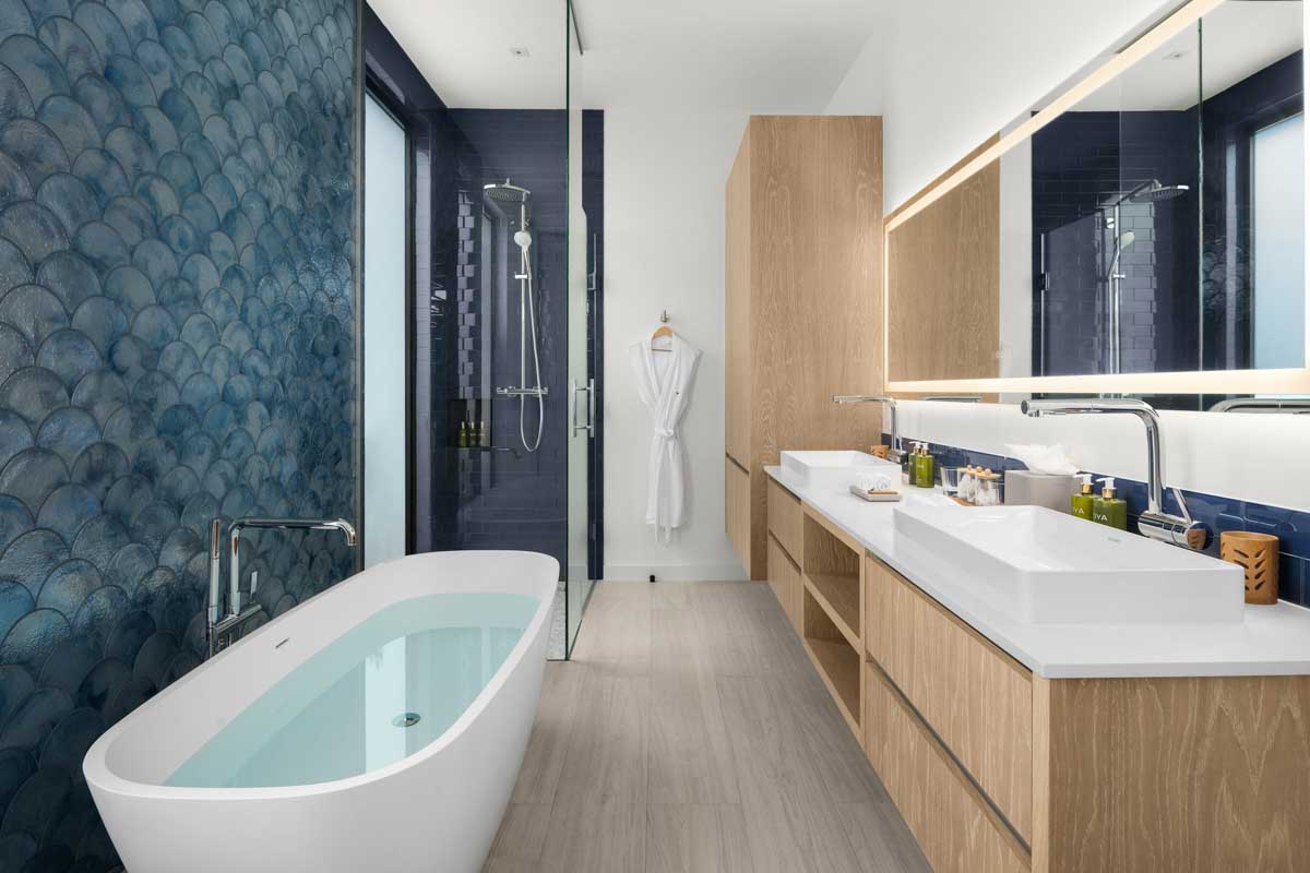 a bathroom with a tub and sink