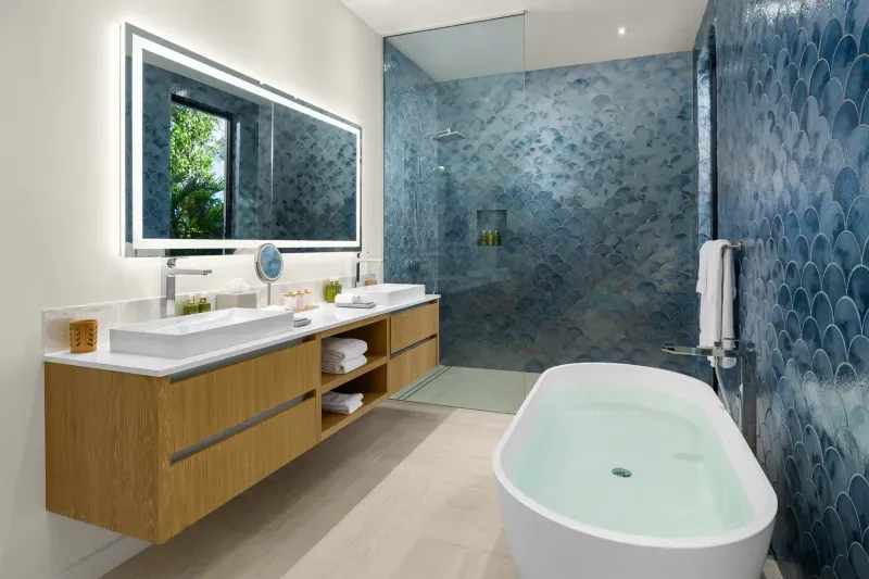a bathroom with a tub and a shower