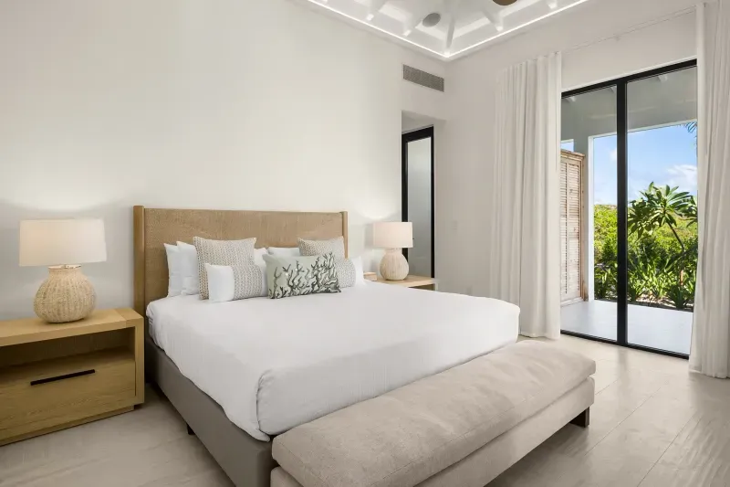 a bedroom with a bed and a table