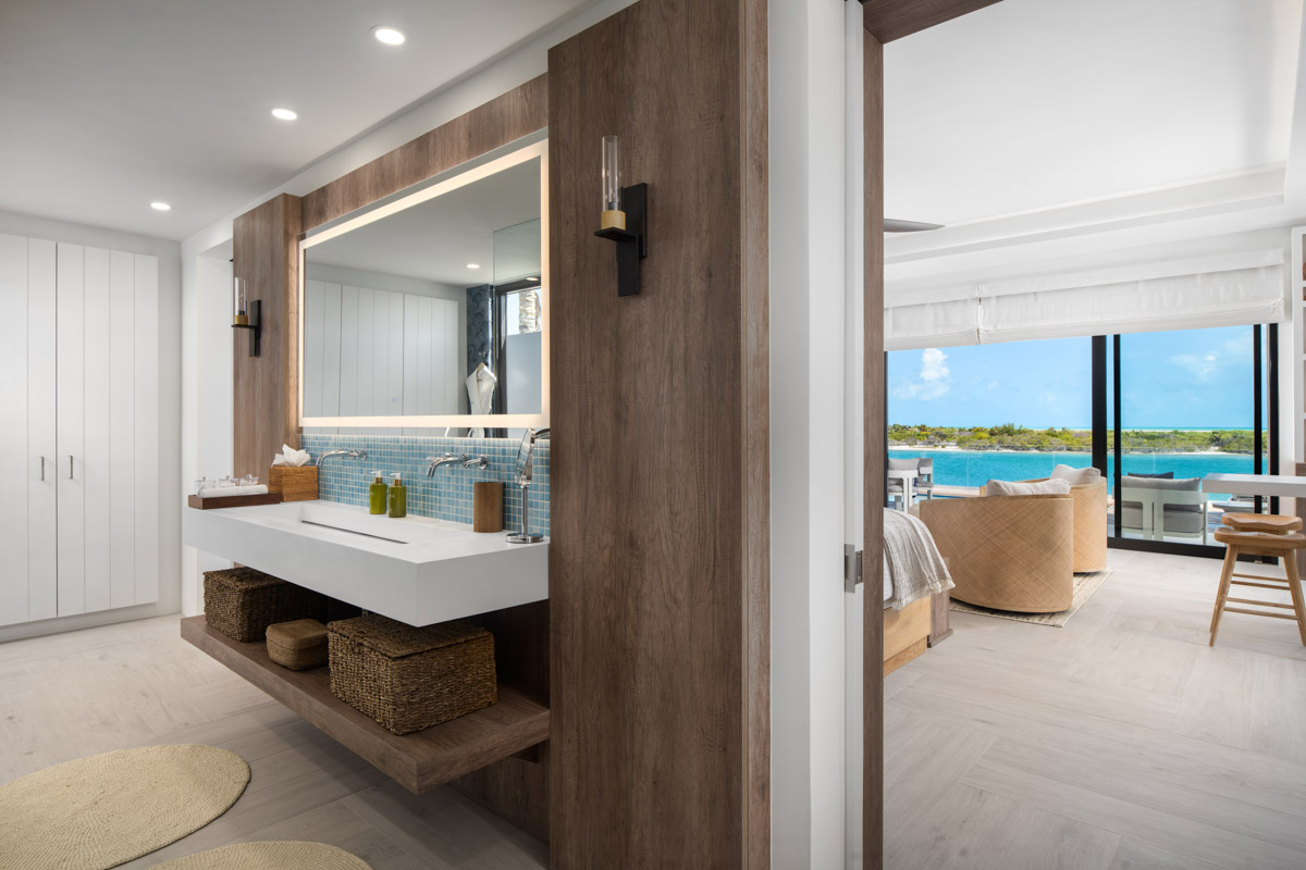 a bathroom with a large mirror and a large mirror
