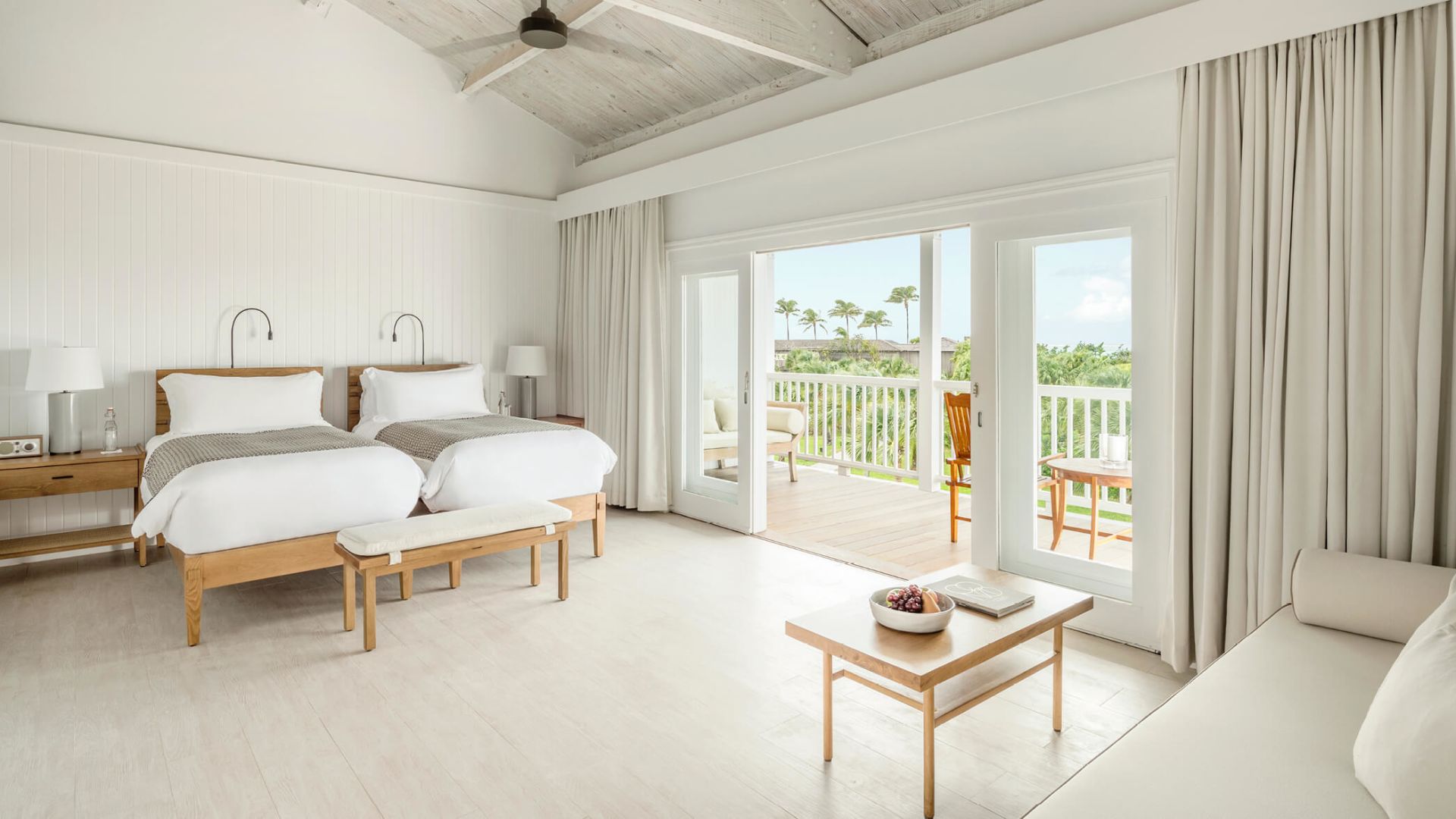 a room with two beds and a table