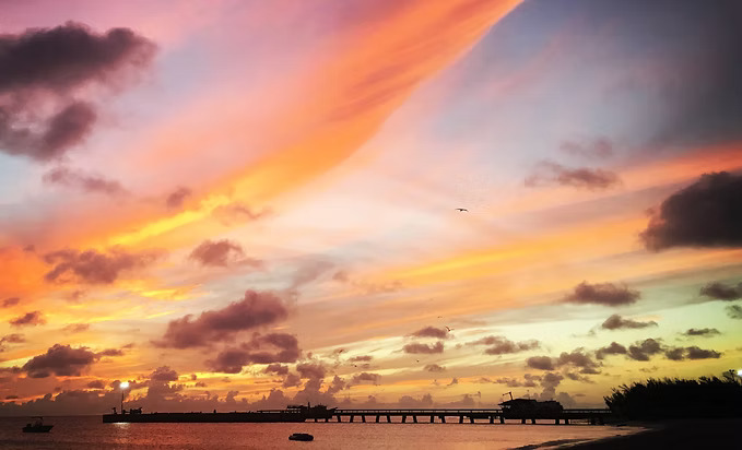 a sunset over a body of water