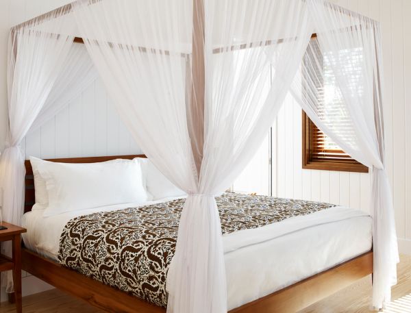a bed with a canopy over it