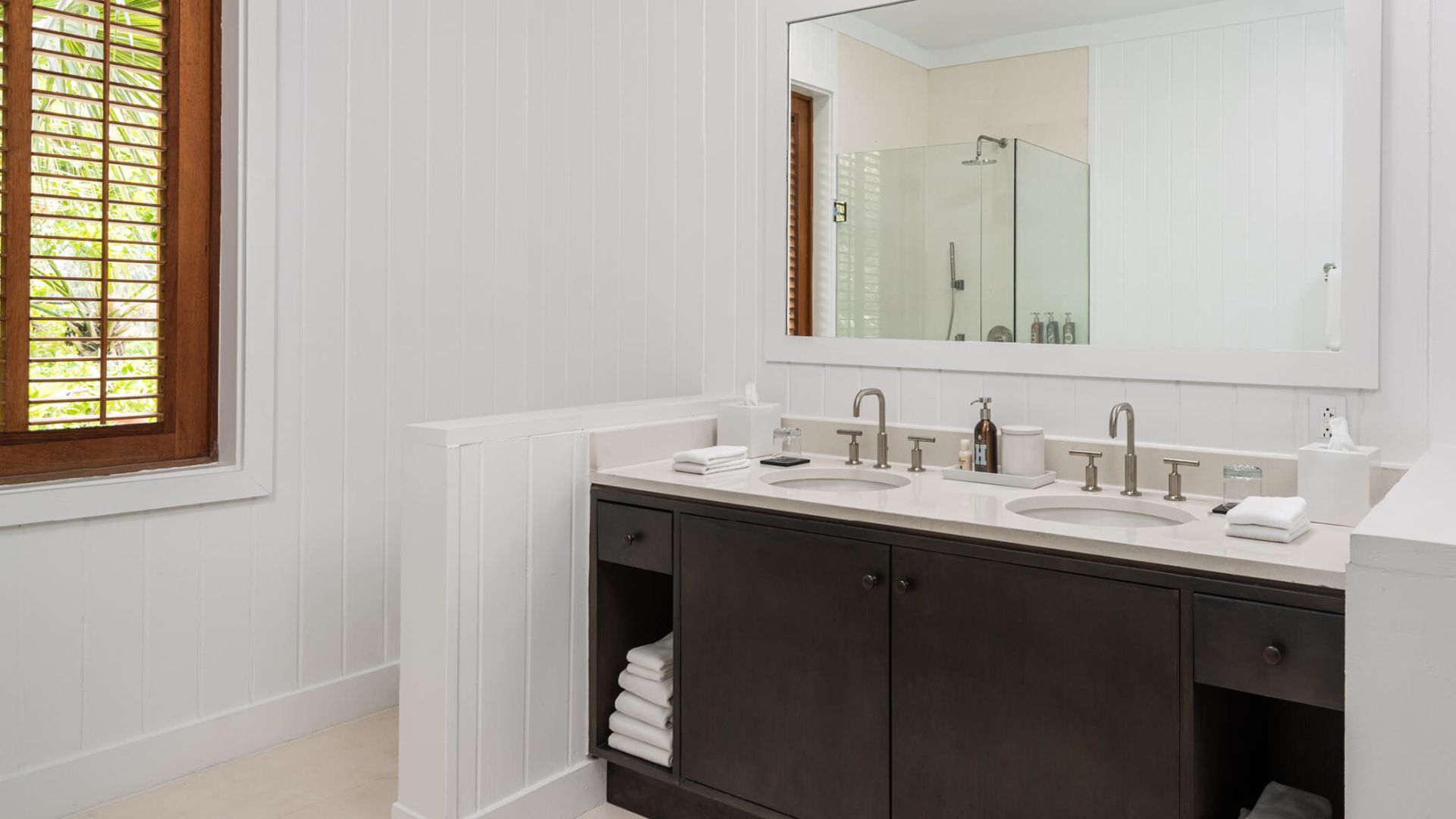 a bathroom with a mirror and sinks