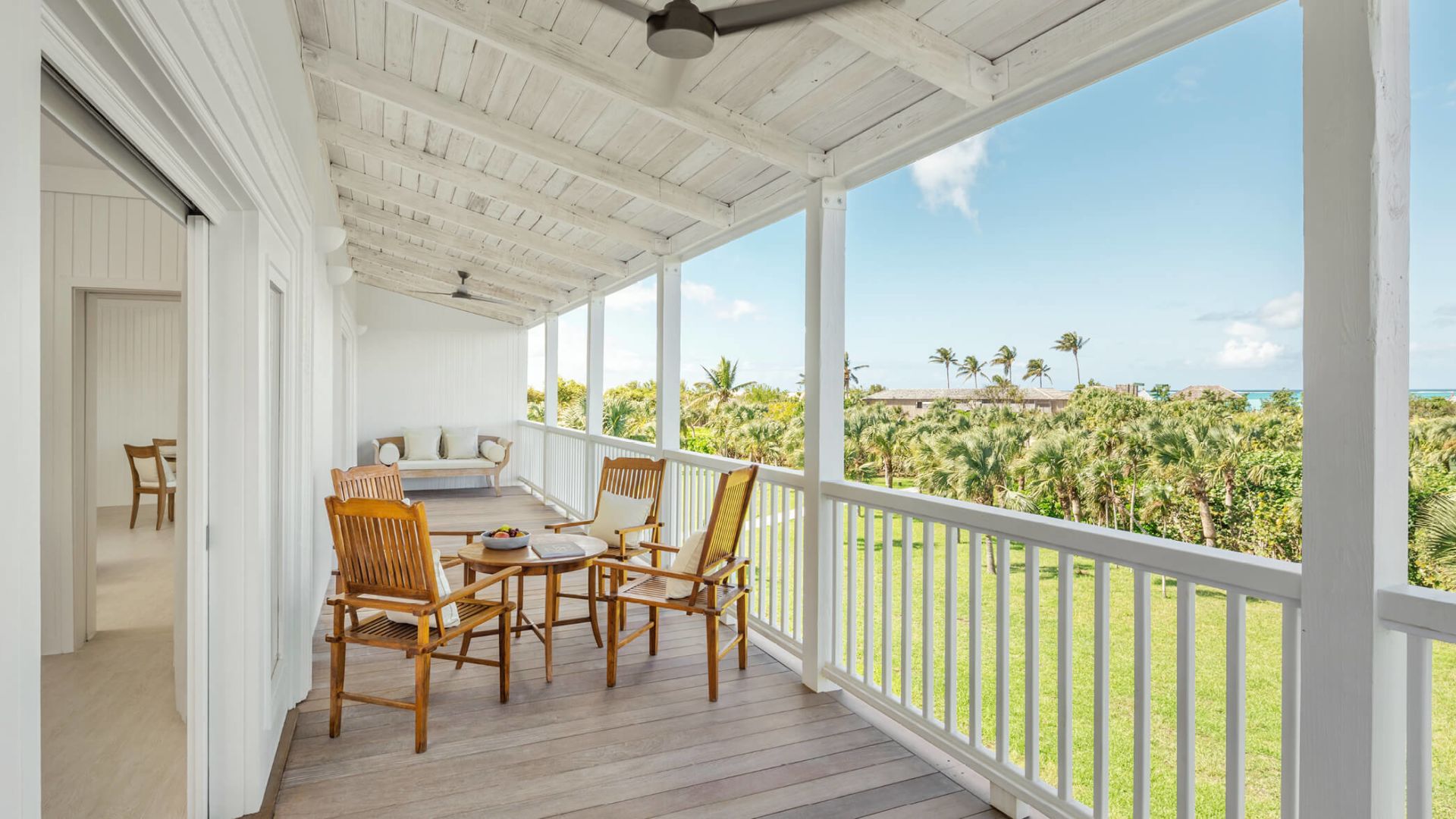 a patio with chairs and a table
