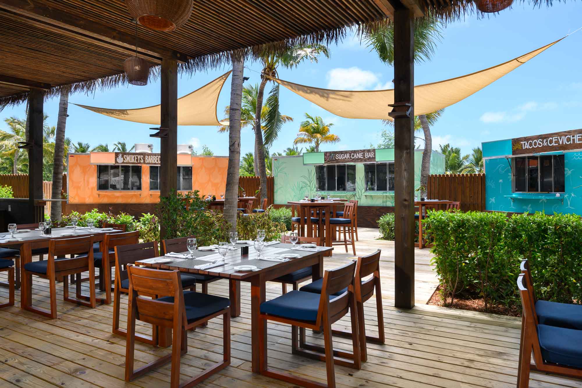 a patio with tables and chairs