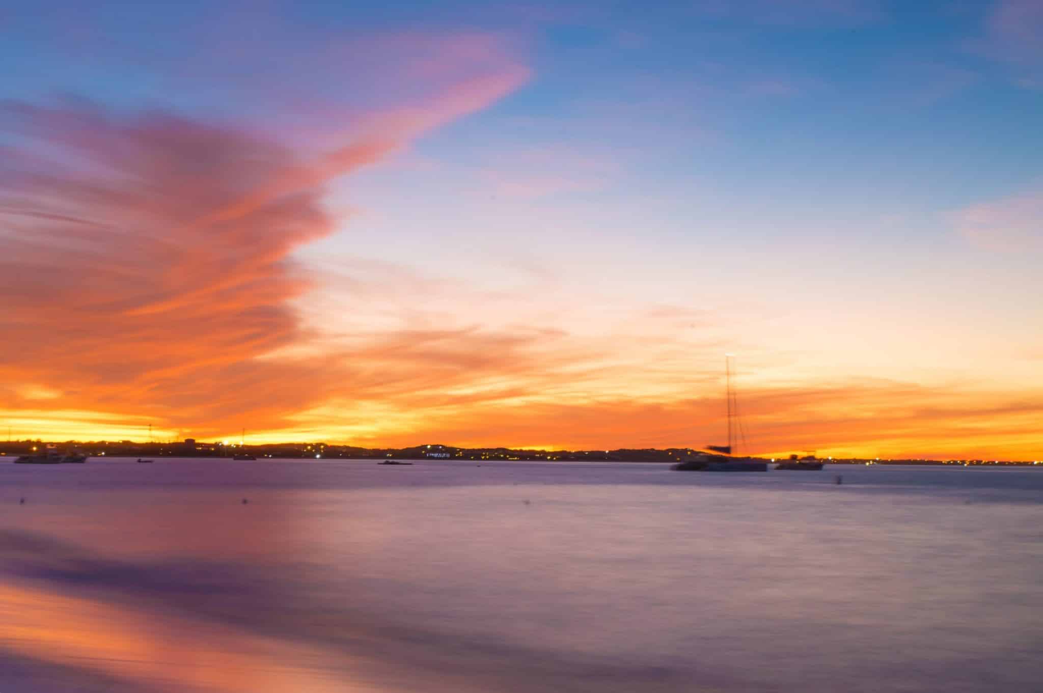 a sunset over a body of water