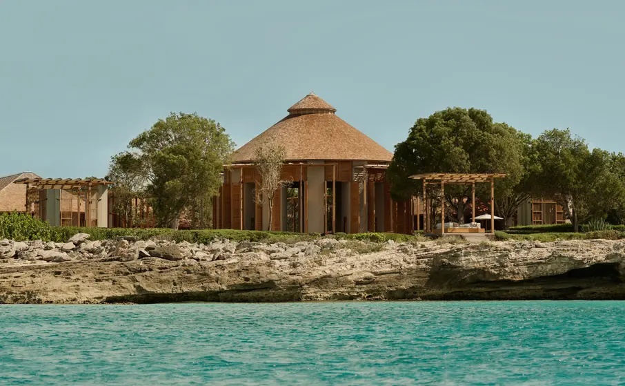 a building on a rocky shore