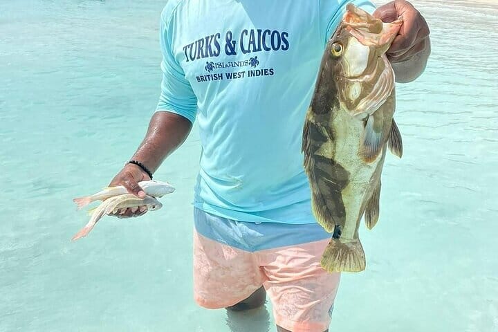 a man holding a fish