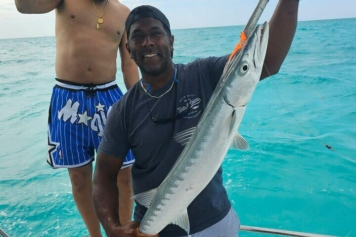 a man holding a fish