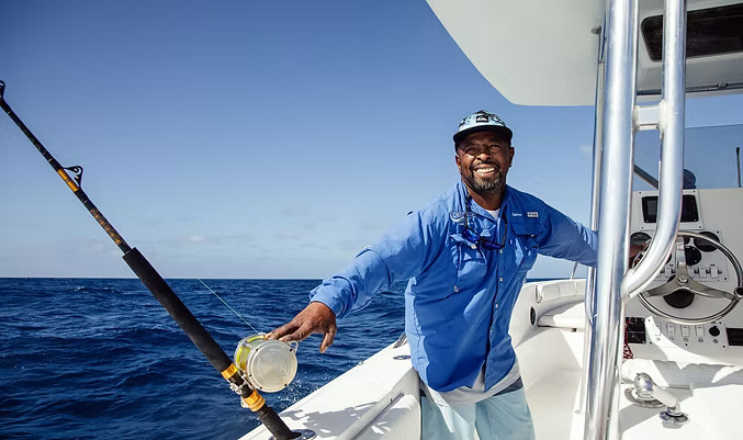 a man in blue shirt on a boat