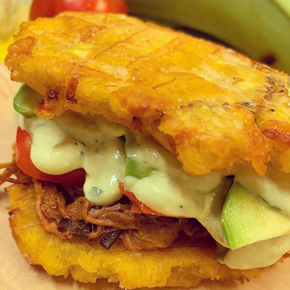 a sandwich with meat and vegetables