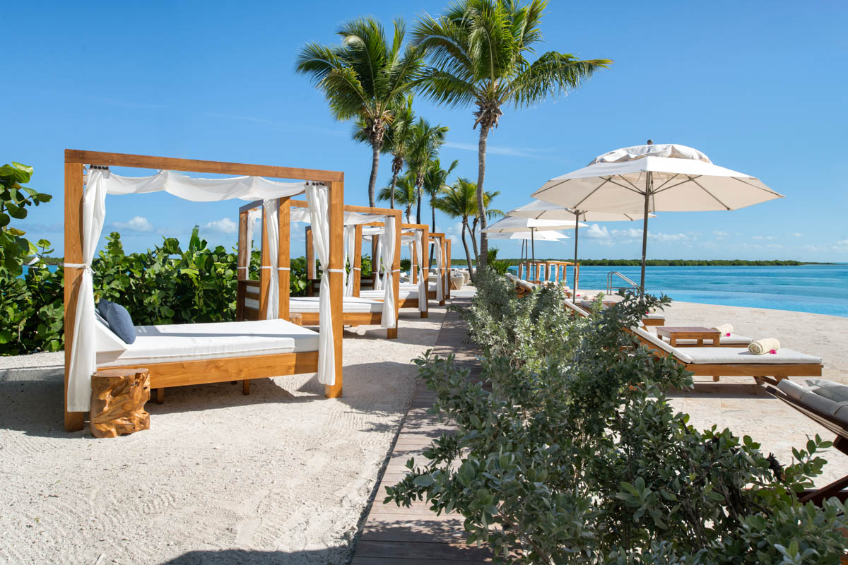 a group of beds on a beach